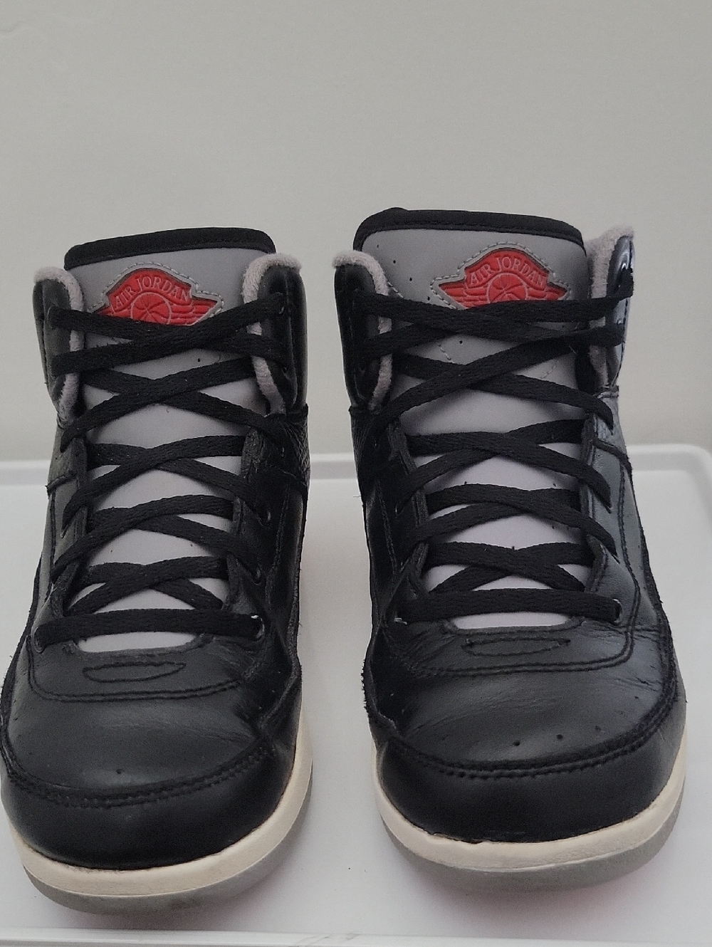 Jordan Kids Black and Gray Sneakers with Red Logo